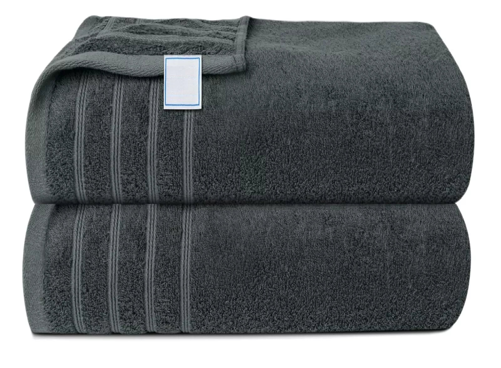 Luxurious bath sheet towel laid out on a bed