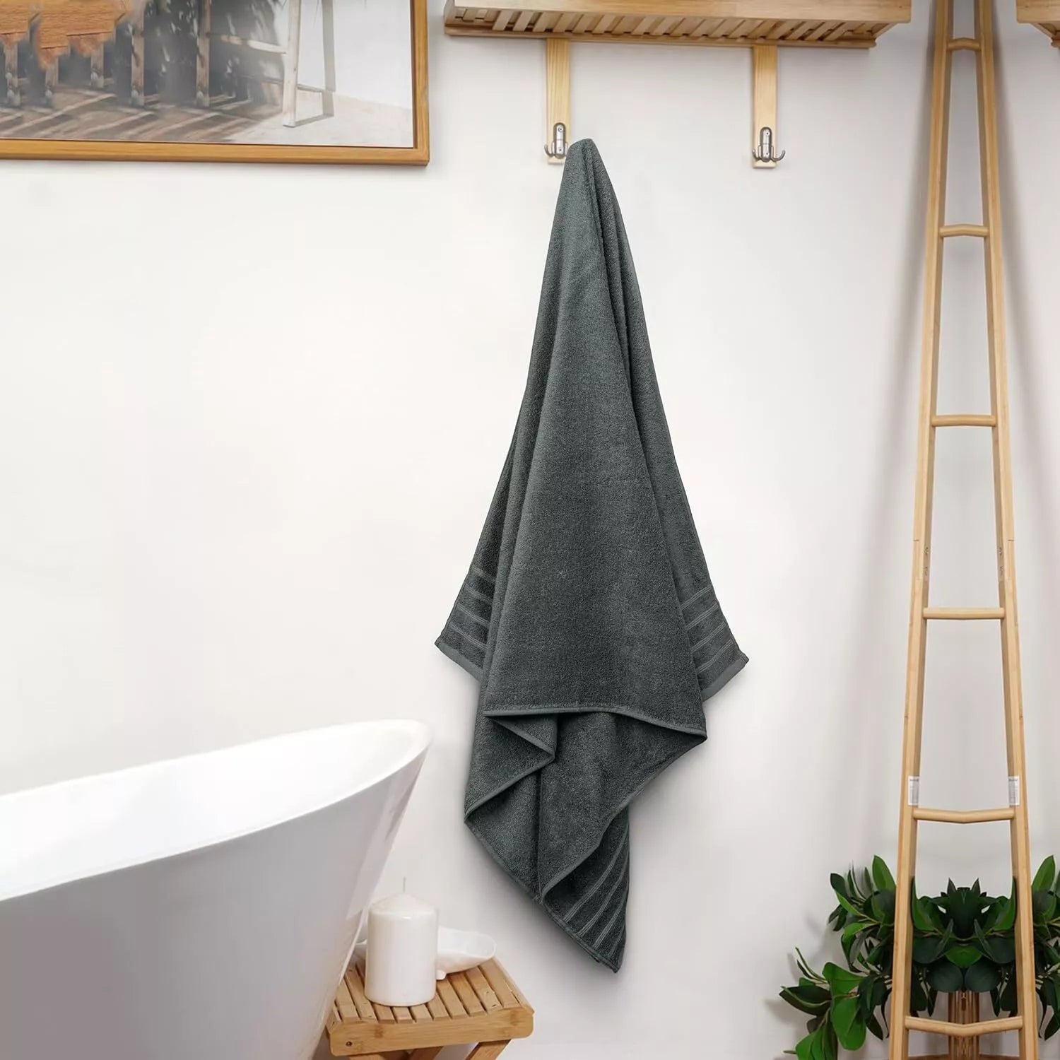 Absorbent towel draped over a bathtub